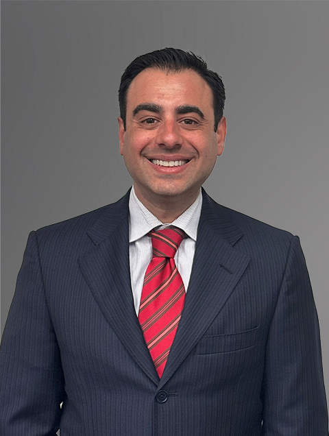 Attorney Alexander Asermely In a Navy Jacket with a White Shirt and Red, Striped Tie